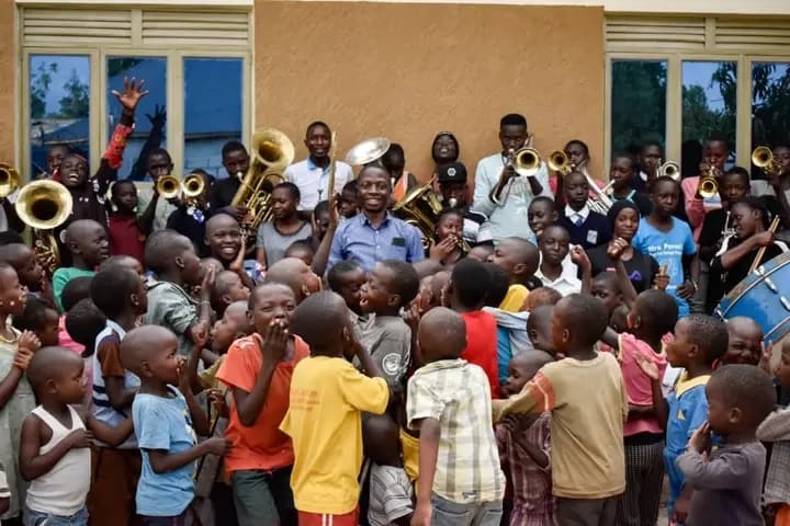Freddie with children at Saved By Music Foundation Uganda