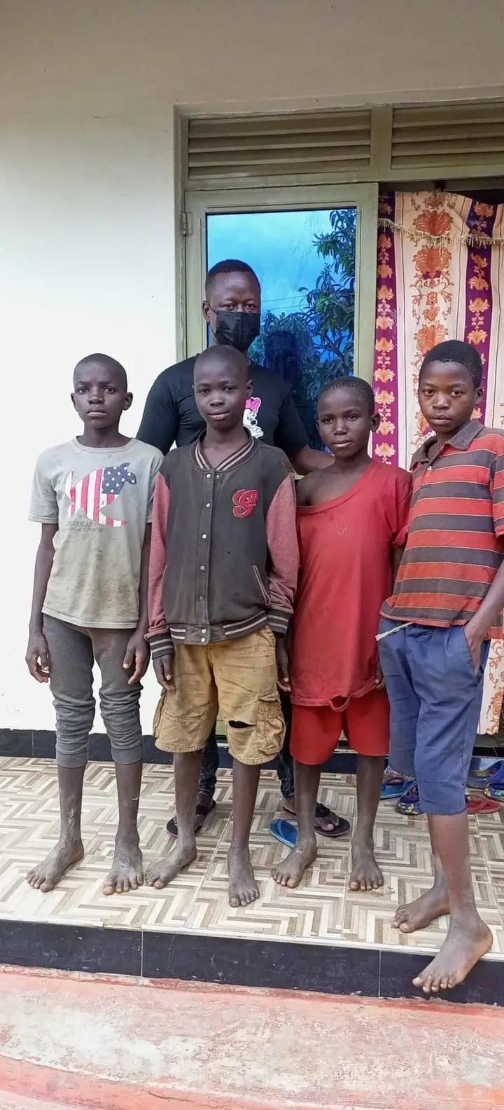 Freddie with four rescued street children in Mbale
